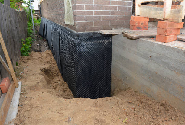 Happy homeowners after waterproofing job in Vanleer